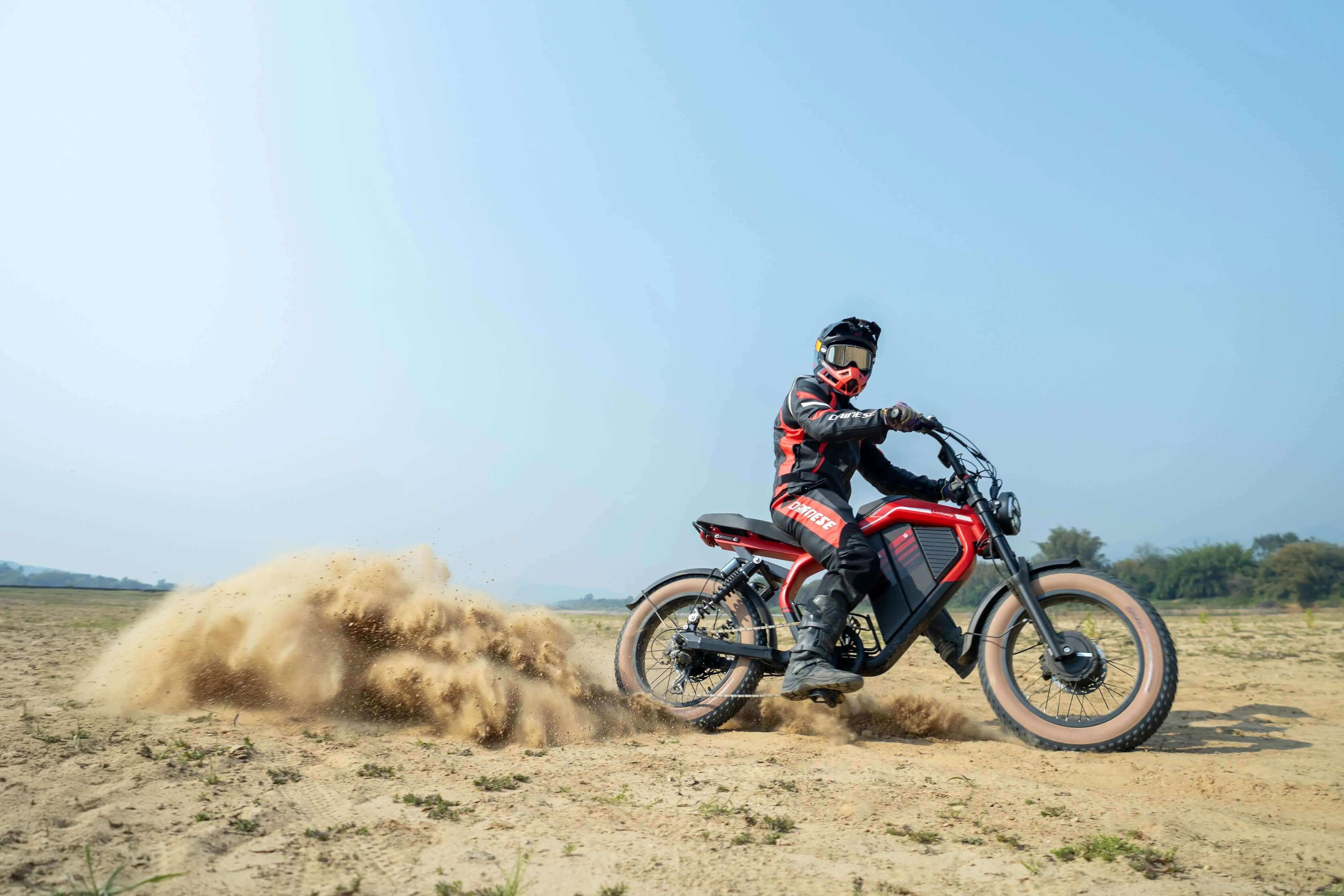 Rider on a red Evoltrix electric off-road motorcycle in our beginner’s off-road electric biking guide