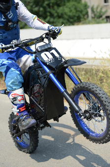 Evoltrix ROGUE MX-01 Off-Road Electric Dirt Bike, Rider Riding on Paved Road Surface
