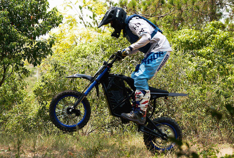 Evoltrix ROGUE MX-01 3000W Off-Road Electric Dirt Bike, Rider Doing Wheelie on Forest Trail